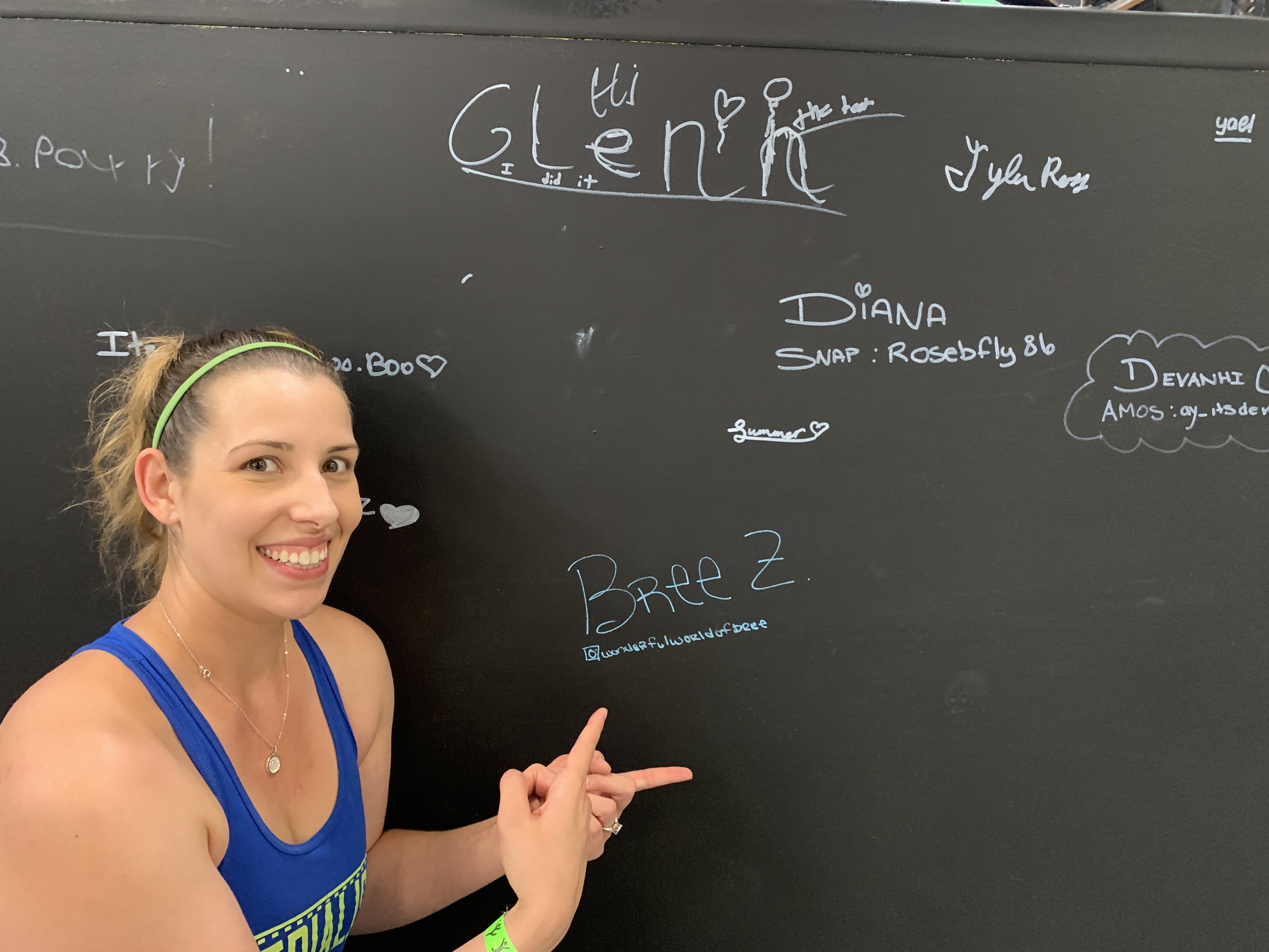 woman in front of chalk wall